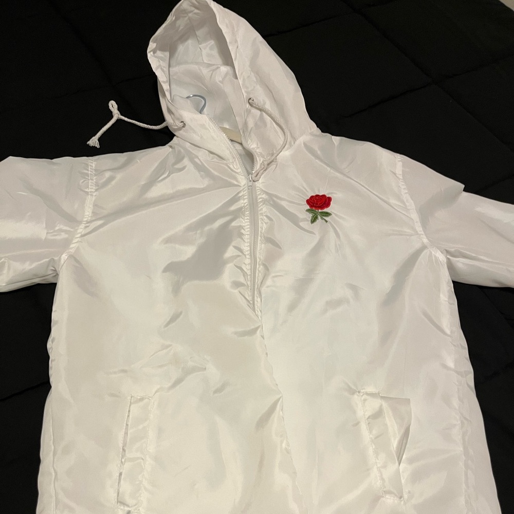Lightweight White wind breaker with rose on front and back.